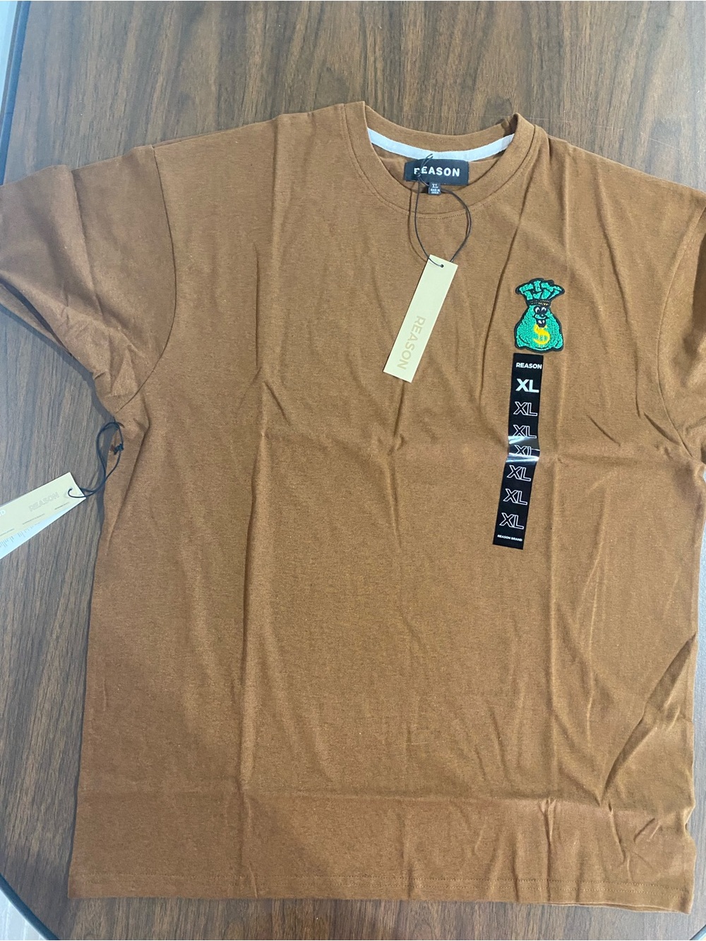 Reason Men's Short-Sleeve Crewneck Tee in Brown with Green Money-Bag Patch